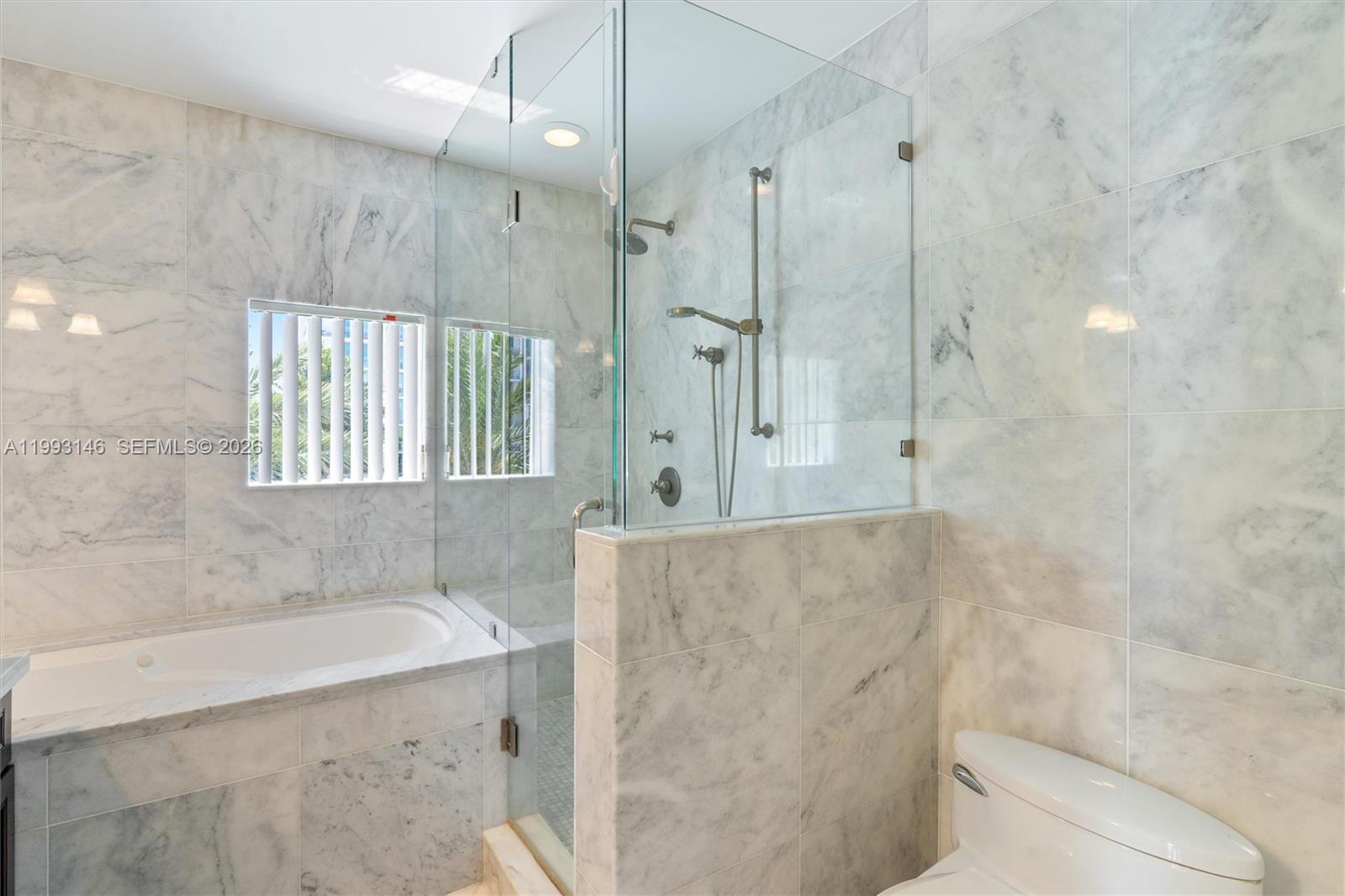 455 East Palmetto Park Road, Unit 3W Boca Raton, FL 33432 - Photo 16 of 31 a bathroom with a bathtub and a shower
