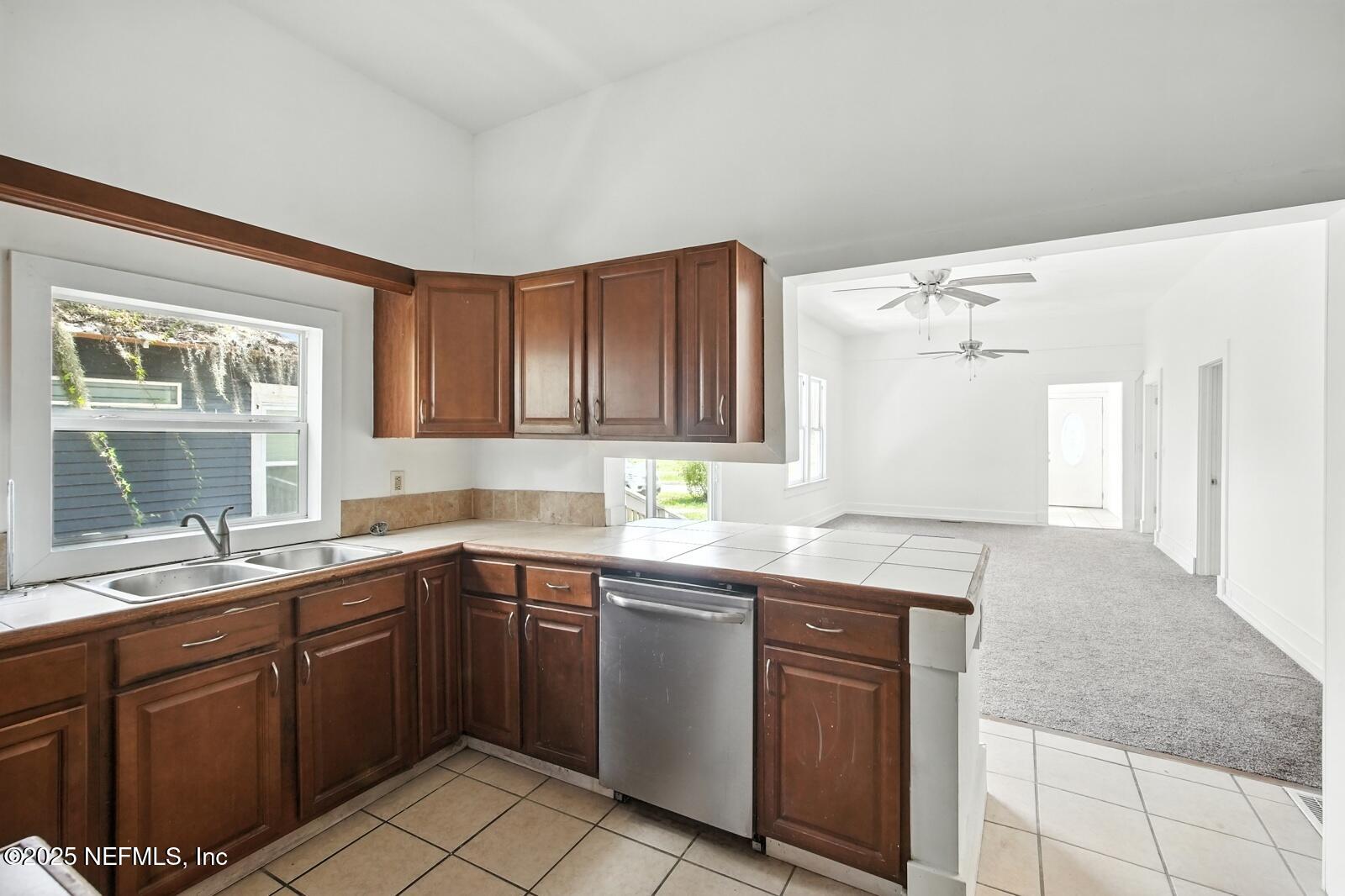 412 Madison Street Palatka, FL 32177 - Photo 14 of 29 a kitchen with a sink stove and cabinets