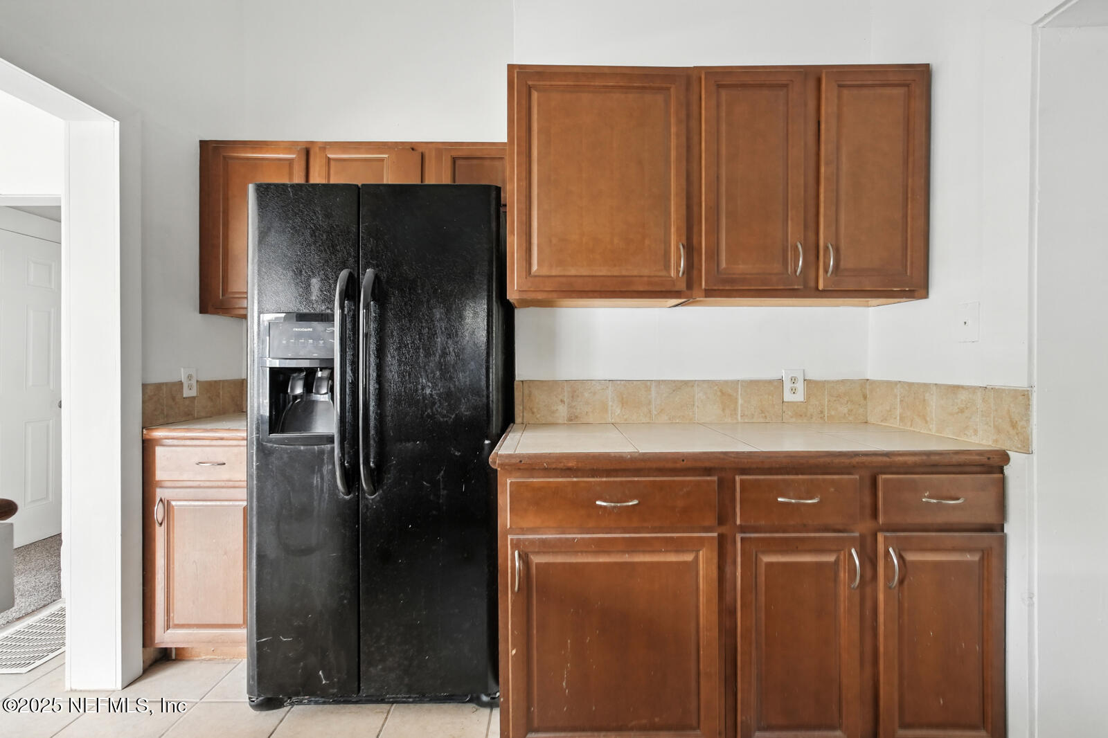 412 Madison Street Palatka, FL 32177 - Photo 15 of 29 a kitchen with stainless steel appliances granite countertop a refrigerator and a stove