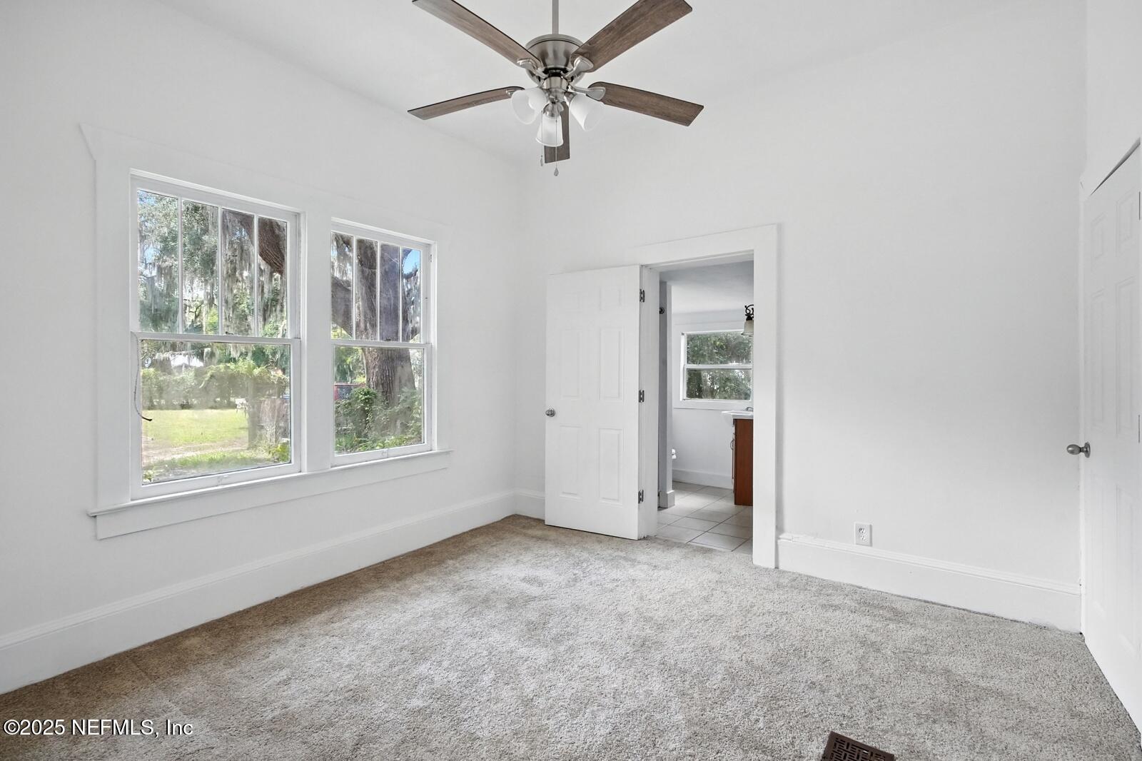 412 Madison Street Palatka, FL 32177 - Photo 16 of 29 an empty room with windows and closet