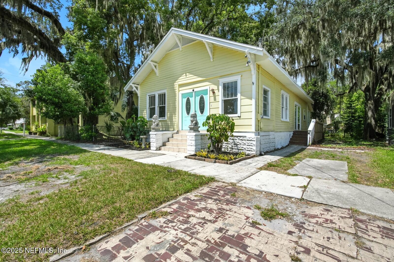 412 Madison Street Palatka, FL 32177 - Photo 2 of 29 a front view of a house with a yard