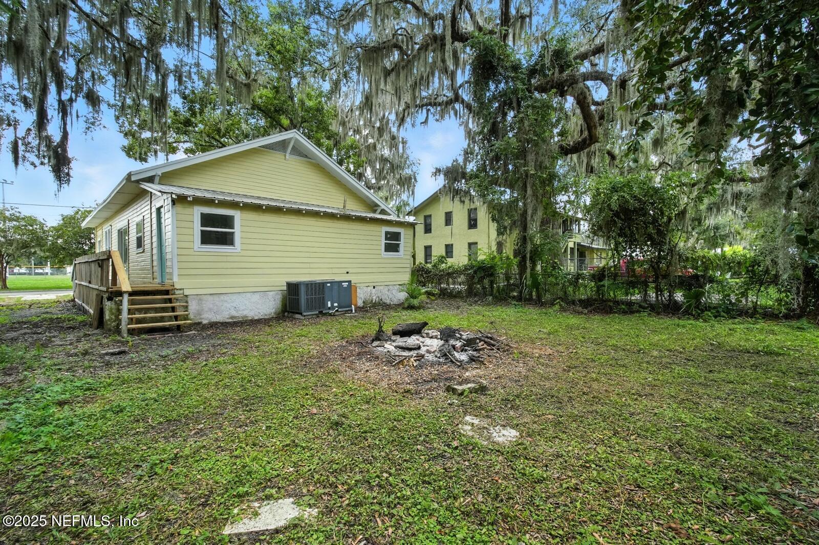 412 Madison Street Palatka, FL 32177 - Photo 24 of 29 a view of a house with a yard