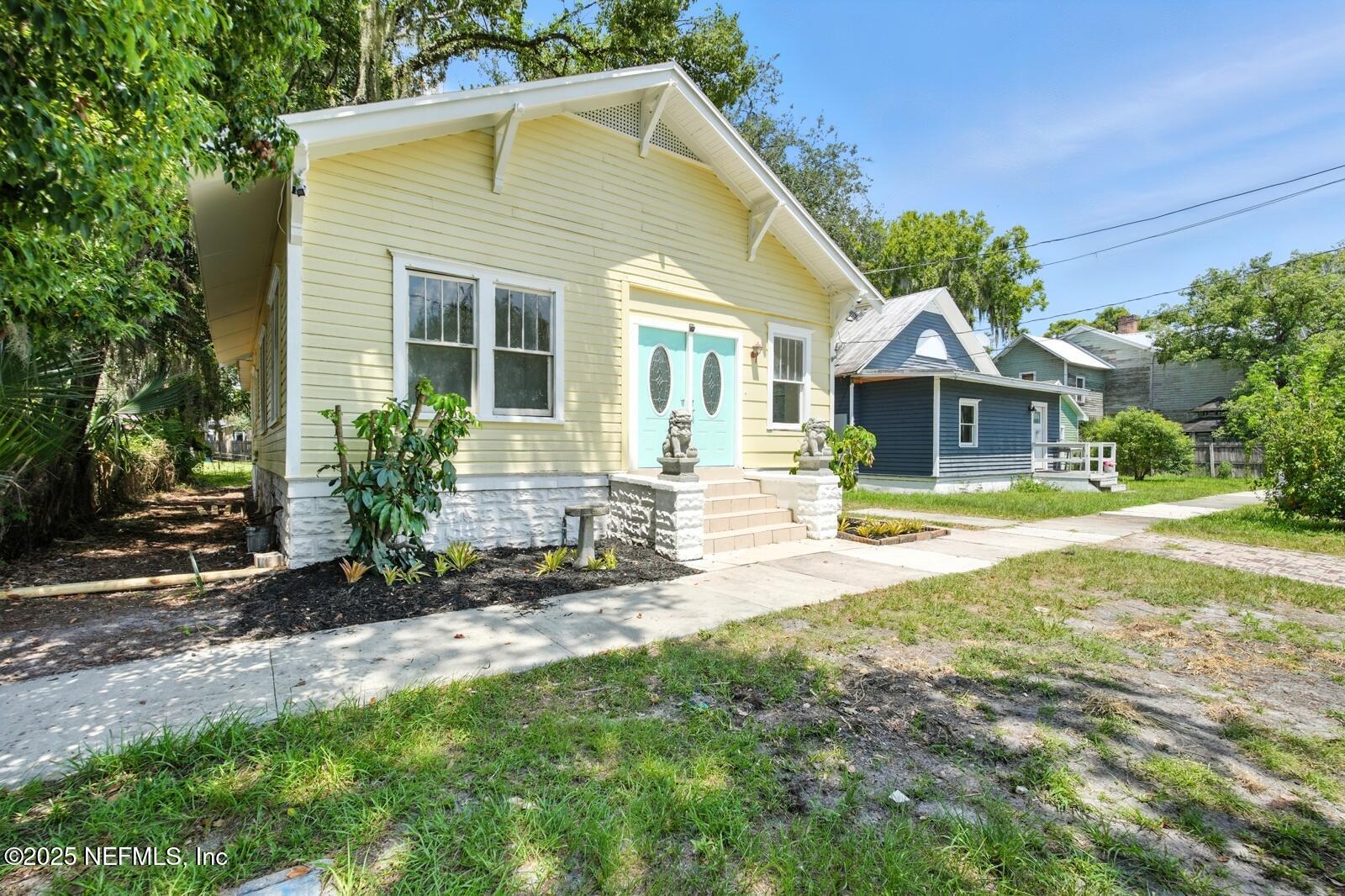 412 Madison Street Palatka, FL 32177 - Photo 3 of 29 a front view of a house with a yard