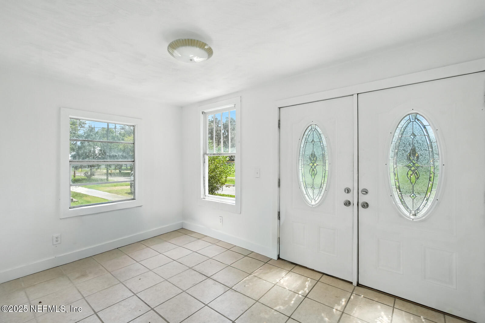 412 Madison Street Palatka, FL 32177 - Photo 6 of 29 a view of a room with painted walls and window