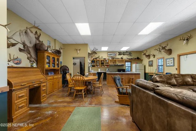 a bedroom with a bed and a tv on the table