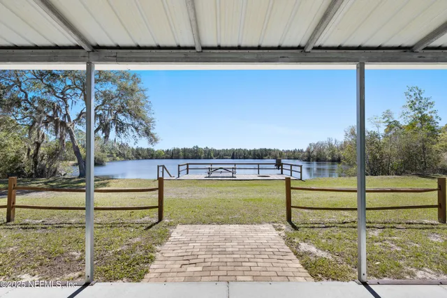 a balcony with furniture and a garden