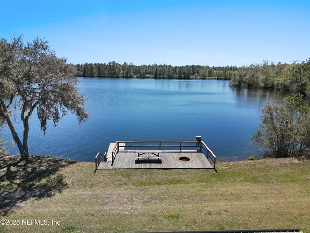 a front view of a house with a lake view