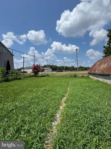 a view of a big yard with a house