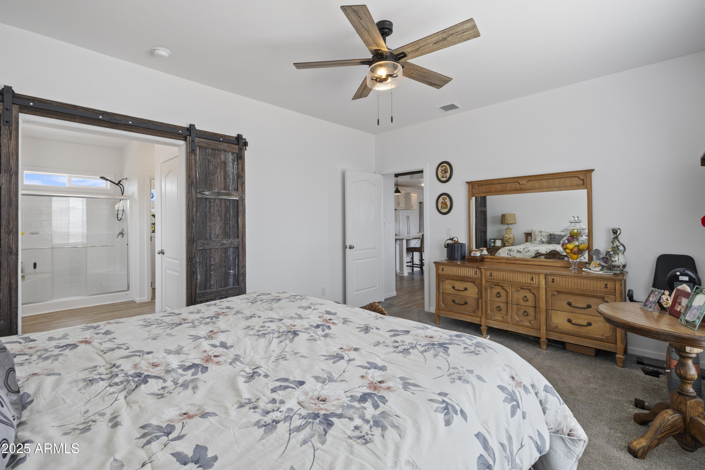 1235 North Harvest Road Dewey, AZ 86327 - Photo 12 of 37 a bedroom with a bed dresser and a large mirror