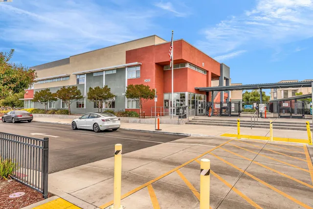 a view of a building with sitting area