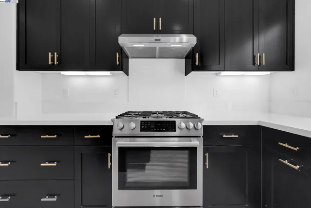 a kitchen with a stove and a microwave