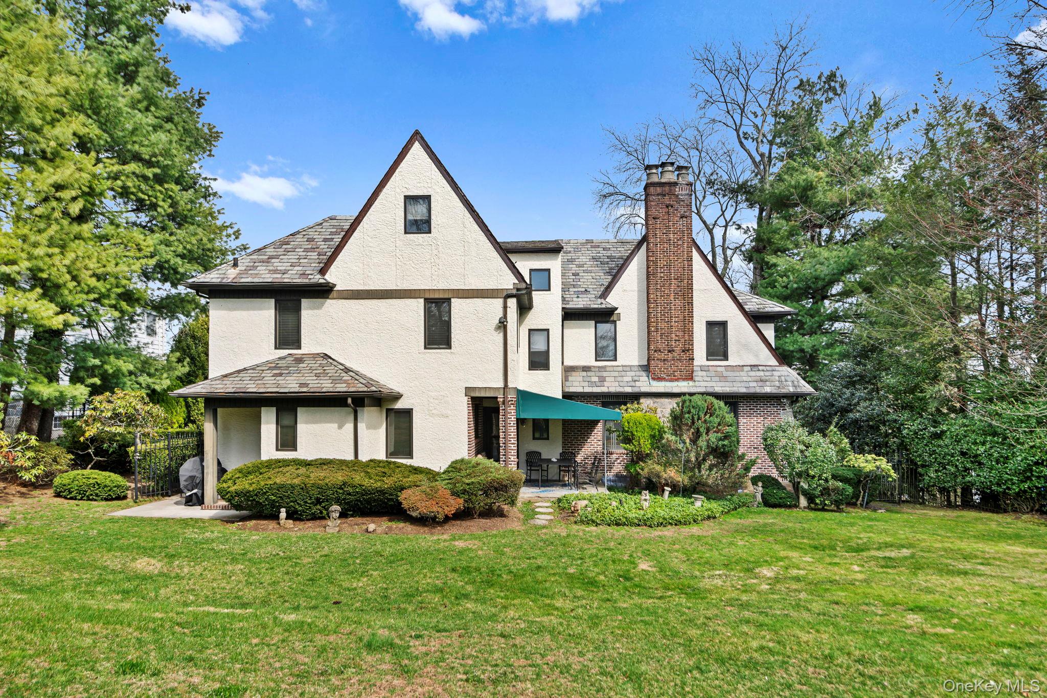 44 Fenimore Road New Rochelle, NY 10804 - Photo 36 of 46 a front view of a house with a yard and porch