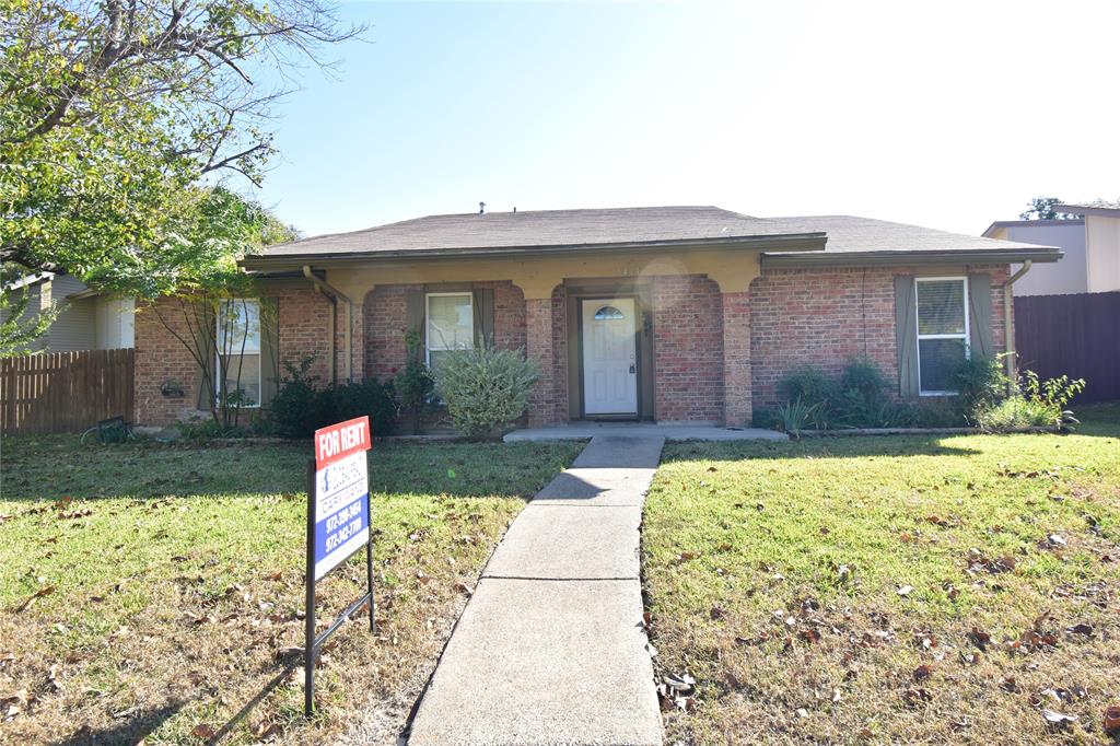Ranch-style home with brick siding and roof with shingles