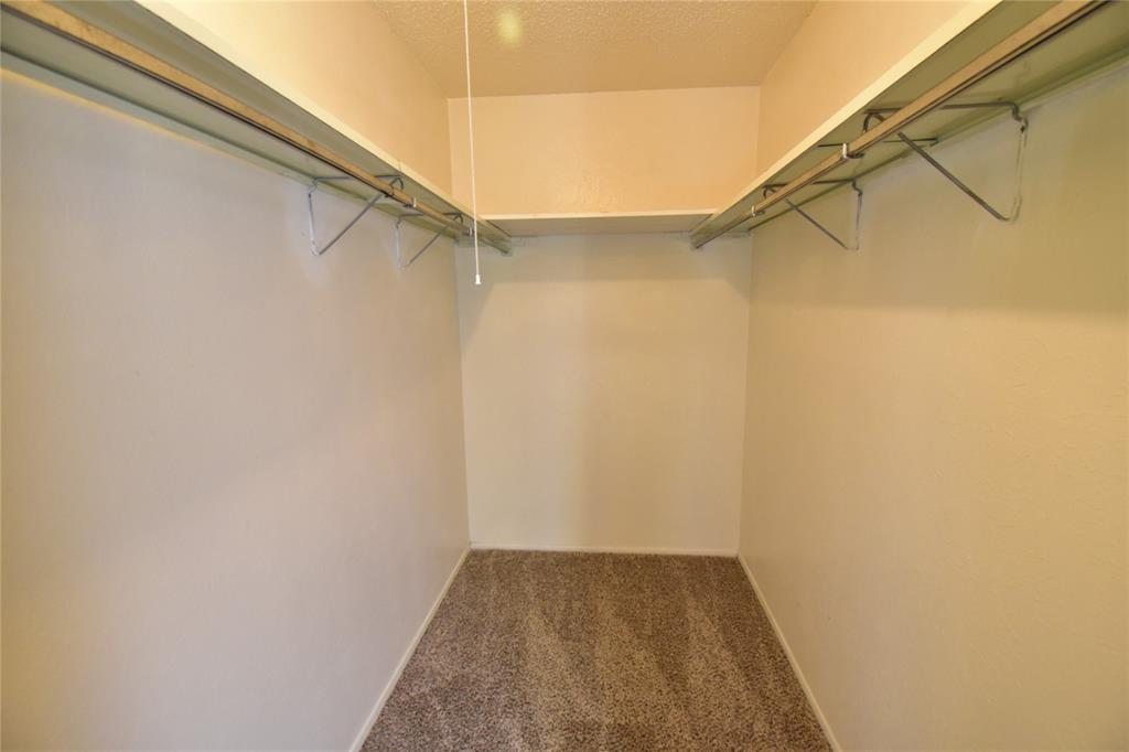 5414 Castleview Lane Garland, TX 75044 - Photo 16 of 20 Walk in closet with carpet flooring