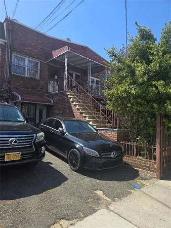 a car parked in front of a house