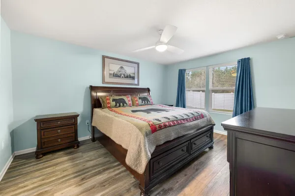 a bedroom with a bed and a table