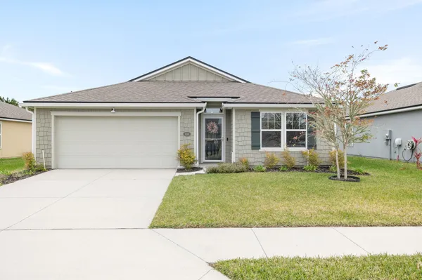 front view of a house with a yard