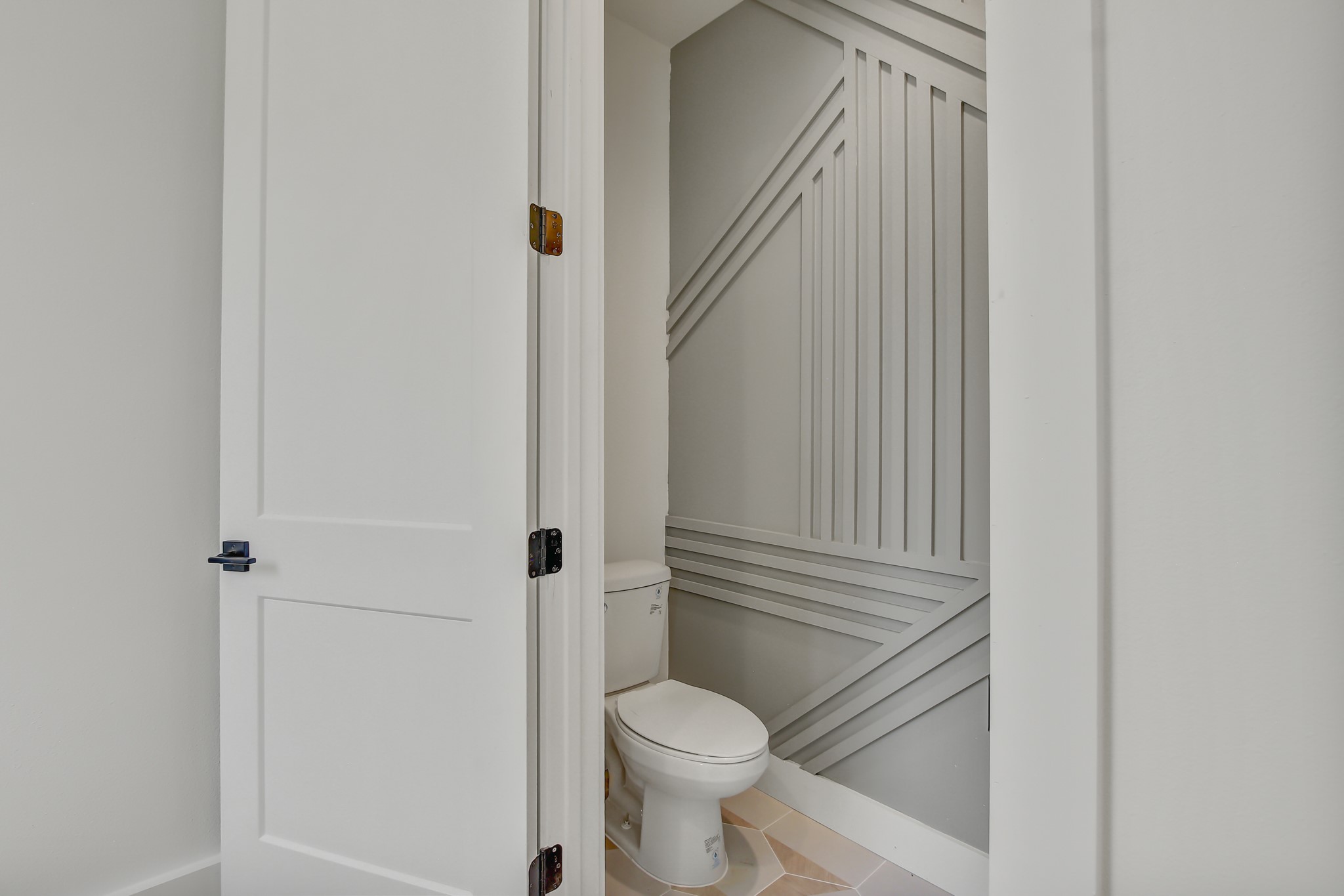 4127 East 12th Street, Unit 8 Austin, TX 78721 - Photo 16 of 32 Bathroom featuring toilet and tile patterned flooring