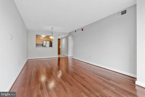 a kitchen with stainless steel appliances granite countertop a stove and a refrigerator
