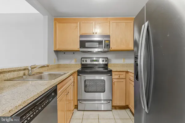 a kitchen with a stove and a microwave