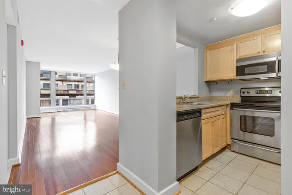 a kitchen with a refrigerator sink and microwave