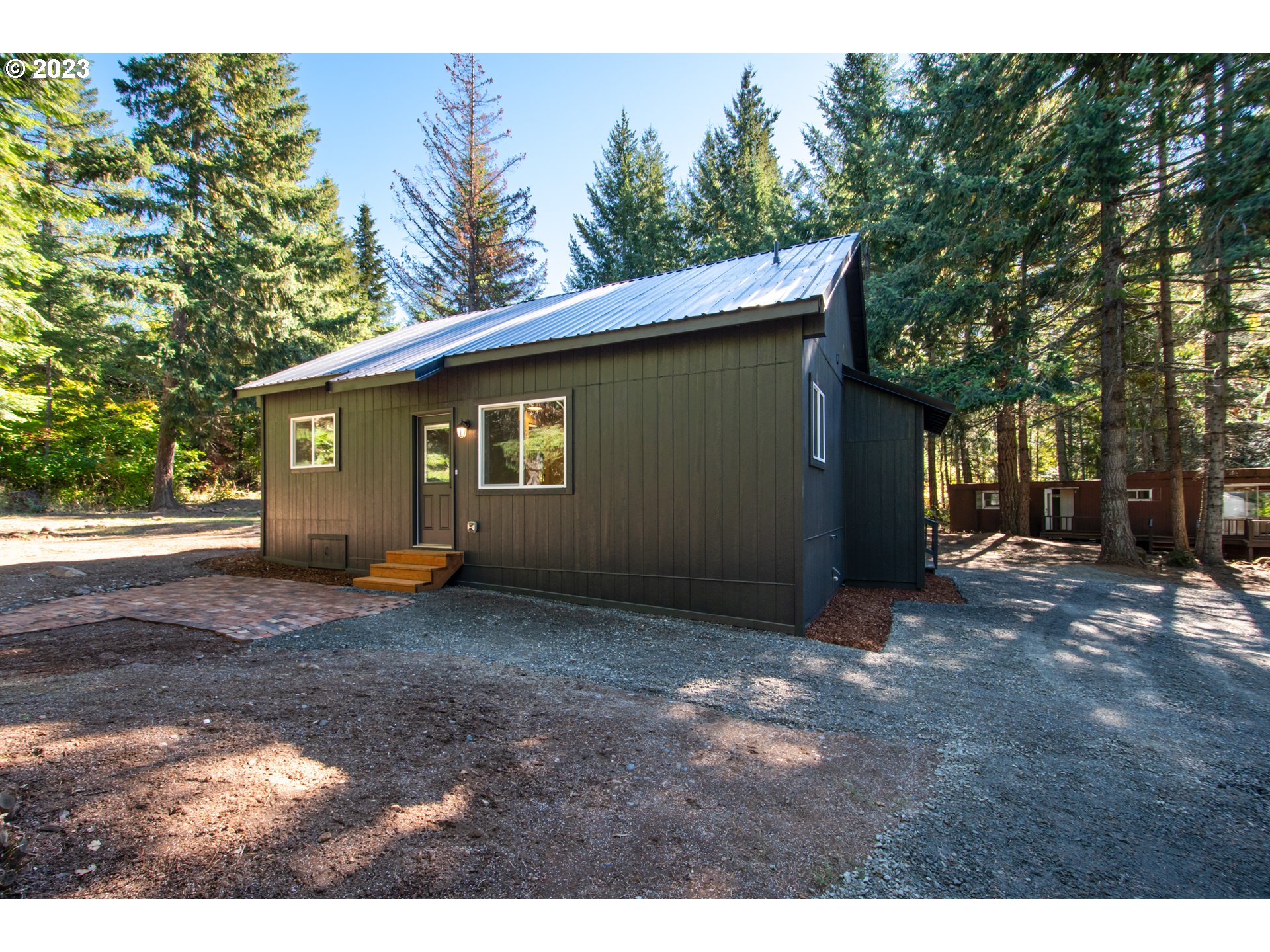 55 Moonshine Road Appleton, WA 98602 - Photo 20 of 33 a view of a house with a yard