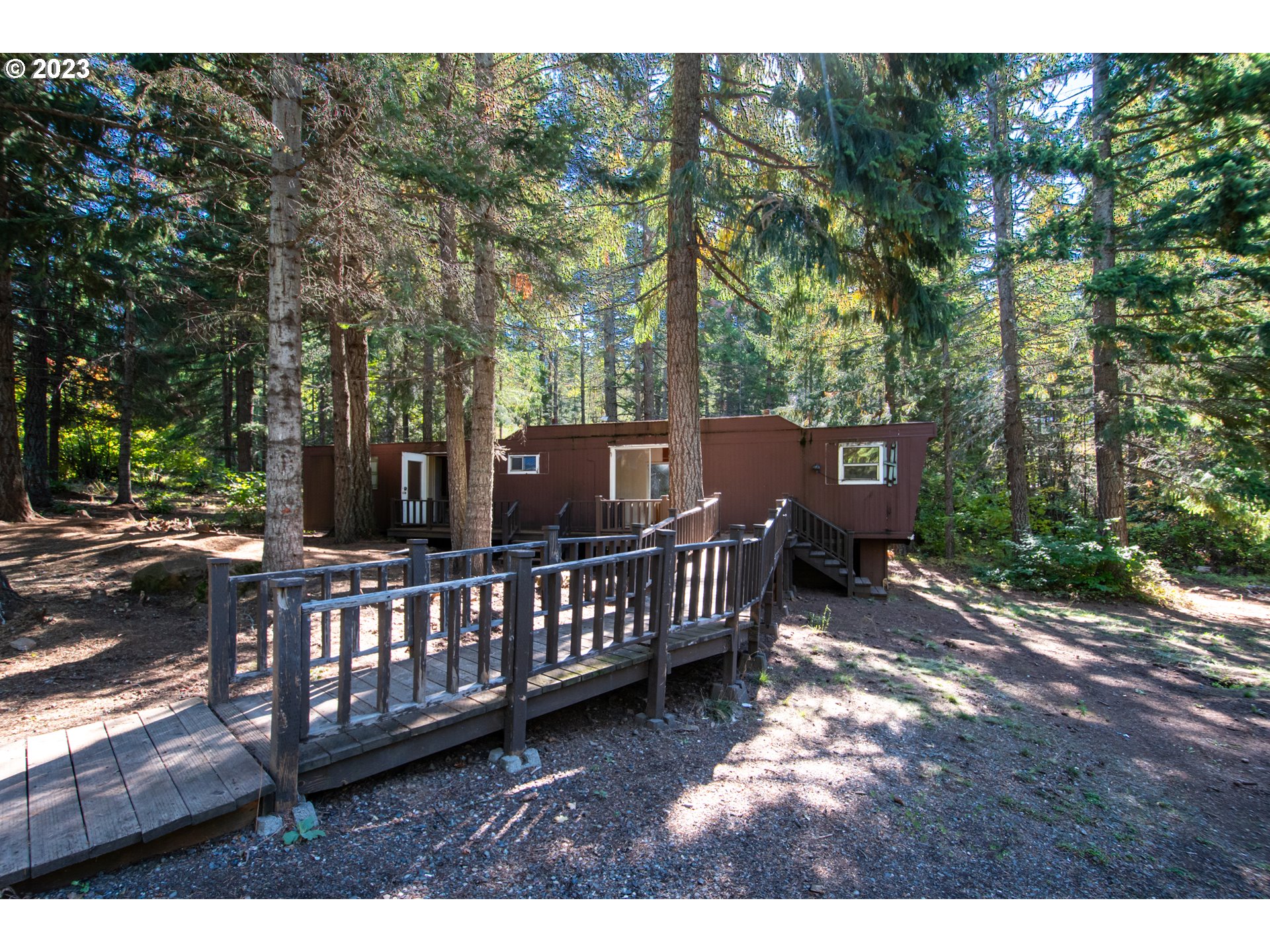 55 Moonshine Road Appleton, WA 98602 - Photo 23 of 33 a view of a deck with a yard