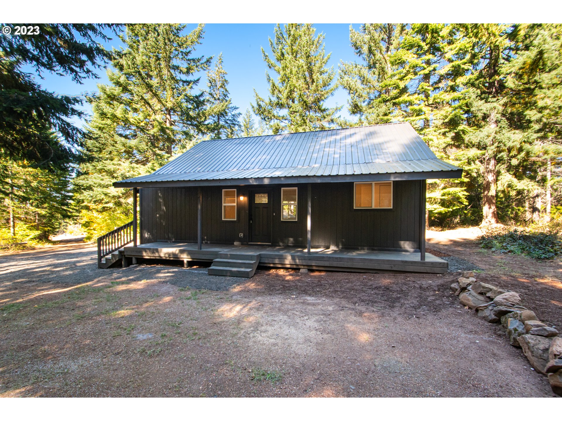 55 Moonshine Road Appleton, WA 98602 - Photo 33 of 33 a view of a house with a yard and sitting area