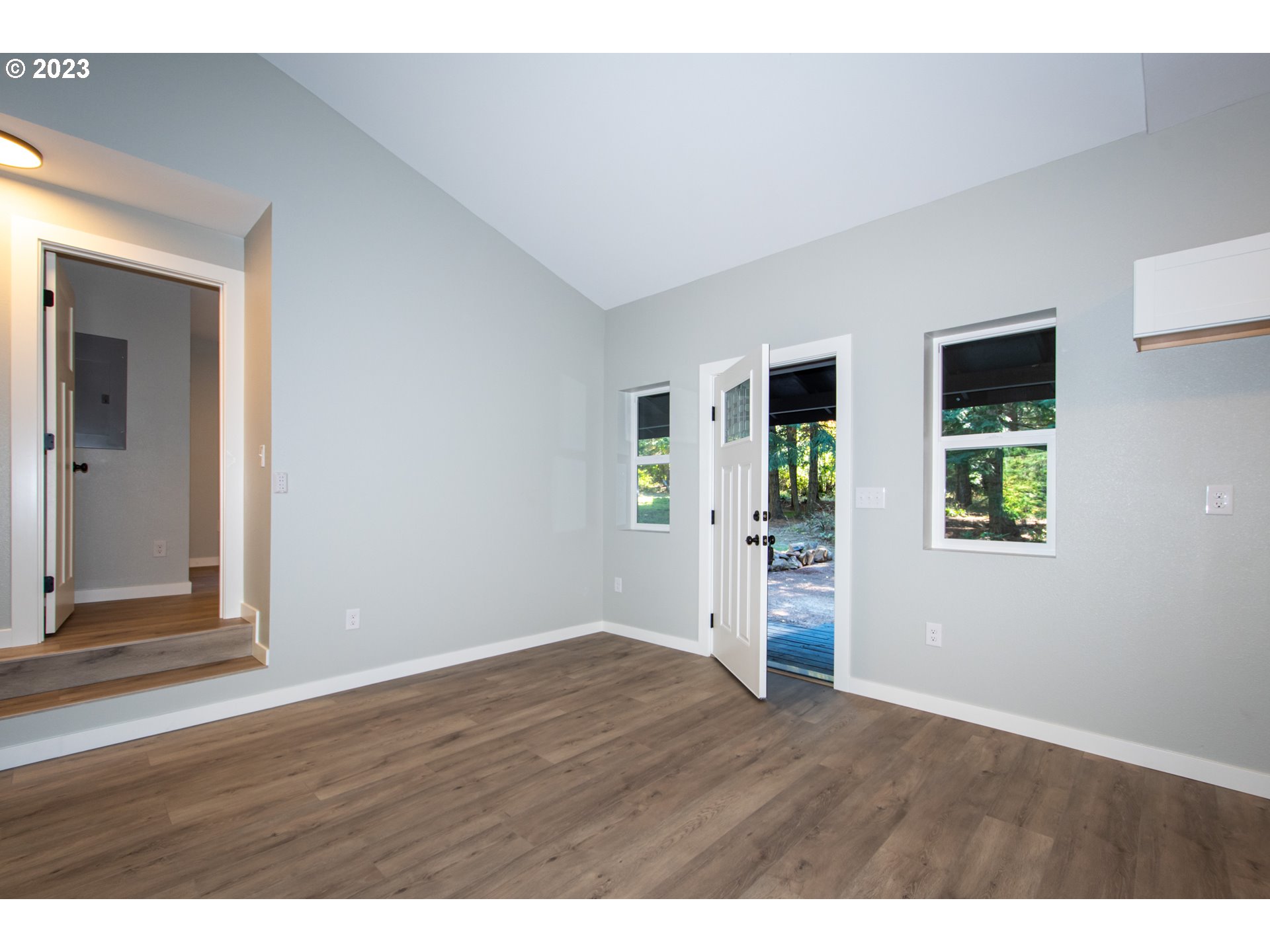 55 Moonshine Road Appleton, WA 98602 - Photo 5 of 33 a view of an empty room with wooden floor and a window