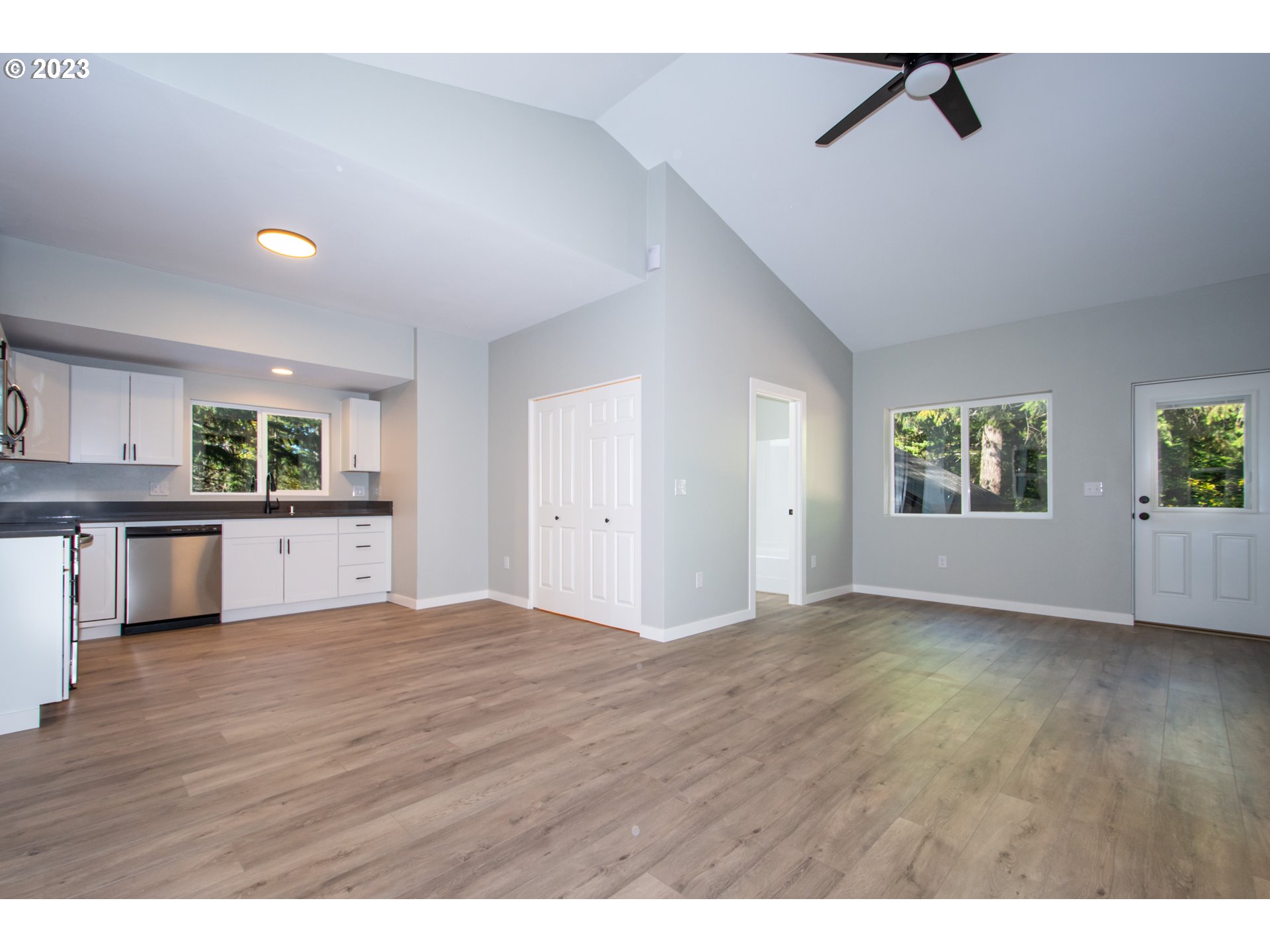 55 Moonshine Road Appleton, WA 98602 - Photo 7 of 33 a view of an empty room with a window and wooden floor