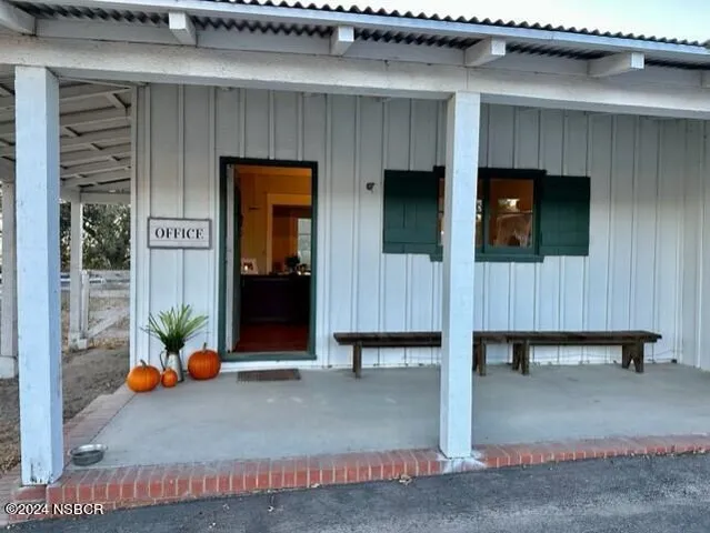 a view of a swimming pool with an outdoor seating