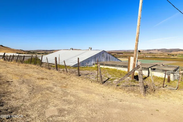 a bedroom with a bed and a desk