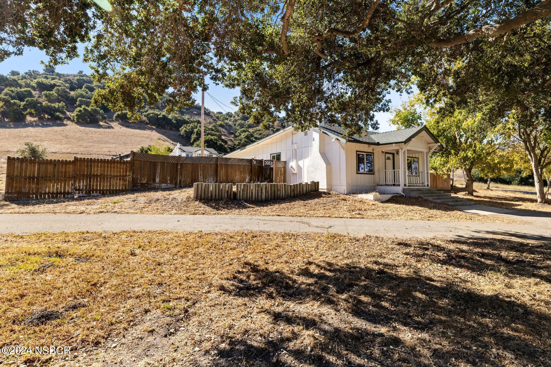 0 Ca Highway Los Alamos, CA 93440 - Photo 38 of 76 a front view of a house with a yard covered in snow