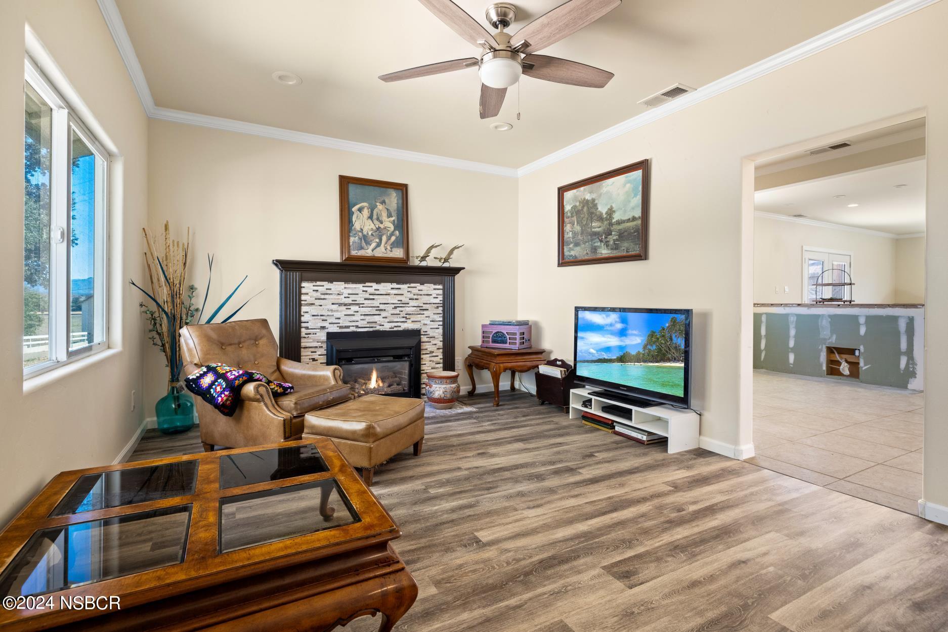0 Ca Highway Los Alamos, CA 93440 - Photo 40 of 76 a living room with furniture a flat screen tv and a fireplace