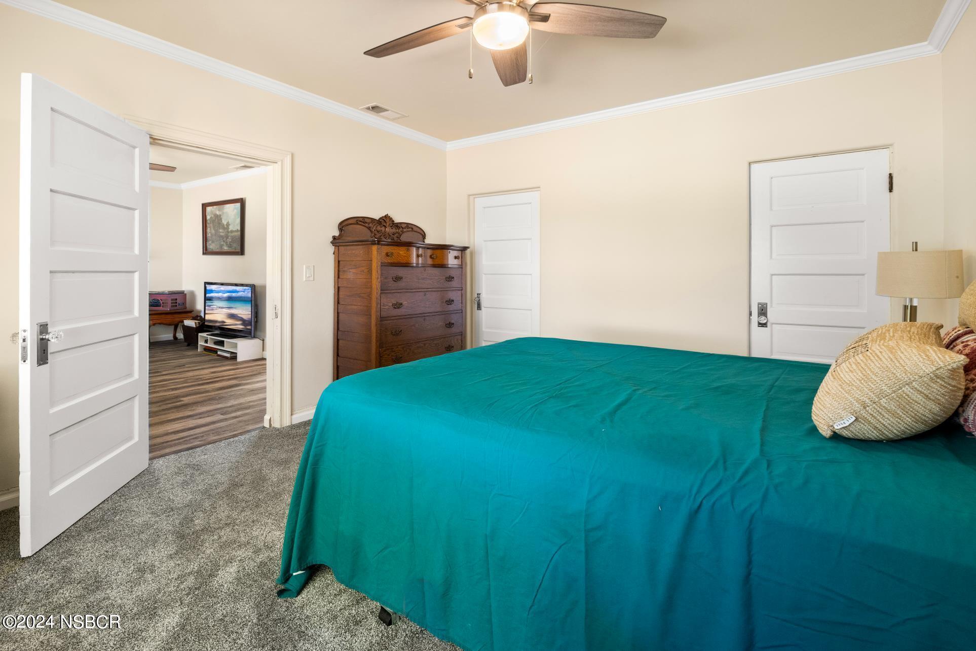 0 Ca Highway Los Alamos, CA 93440 - Photo 41 of 76 a bedroom with a bed and a chandelier