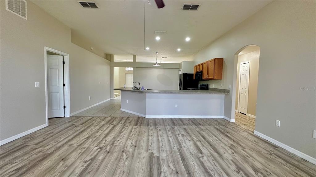 60 Pine Grove Drive Palm Coast, FL 32164 - Photo 15 of 20 a view of a kitchen with a sink and a microwave