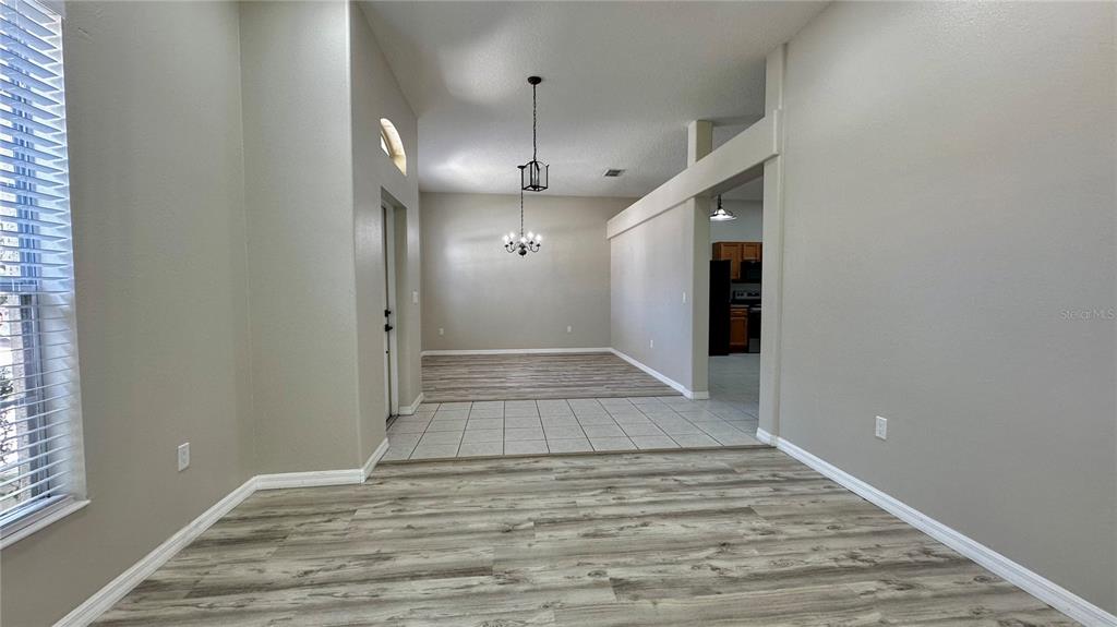 60 Pine Grove Drive Palm Coast, FL 32164 - Photo 20 of 20 a view of an empty room with wooden floor