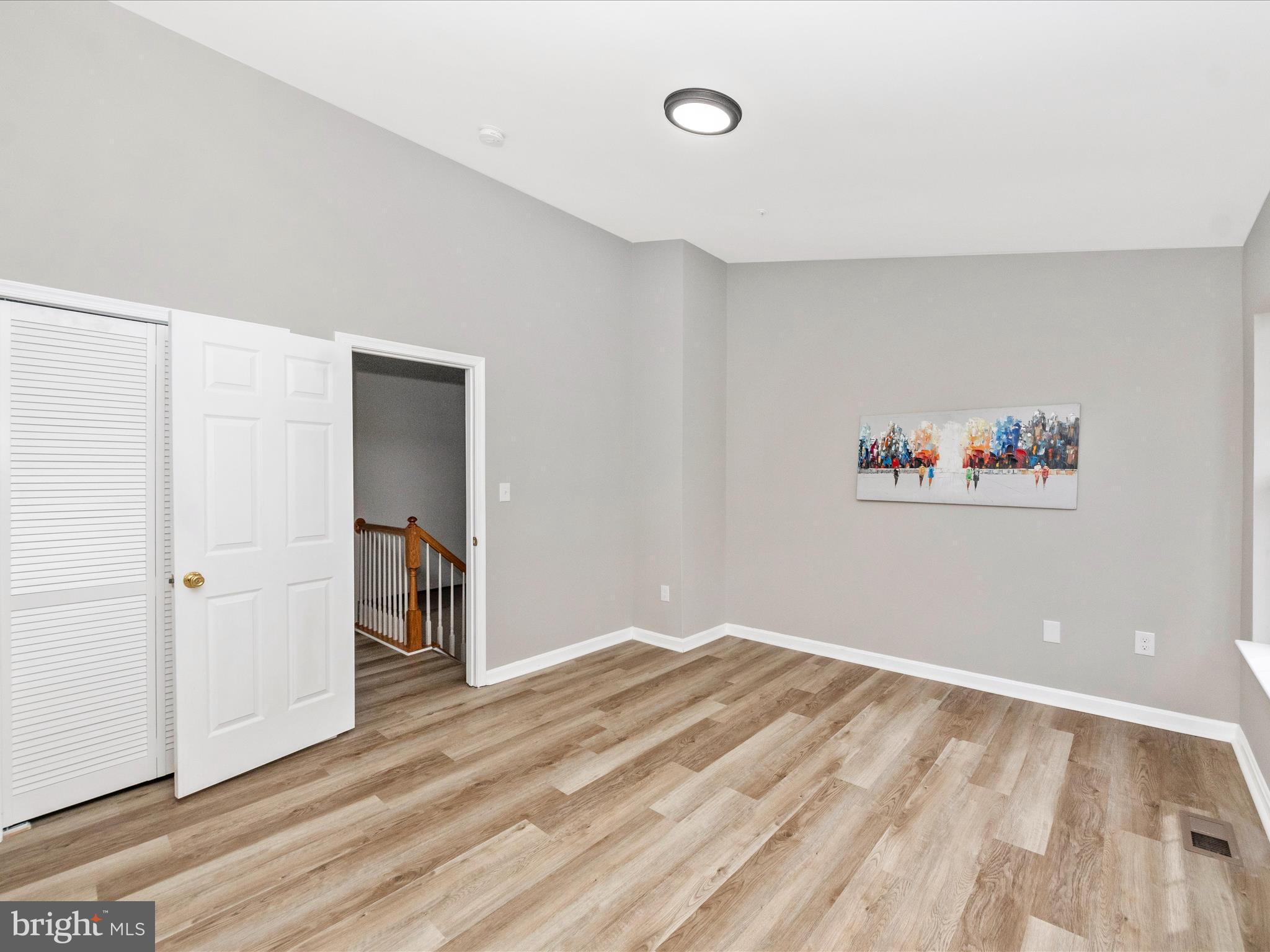 2242 Commissary Circle Odenton, MD 21113 - Photo 25 of 51 a view of a room with wooden floor and closet