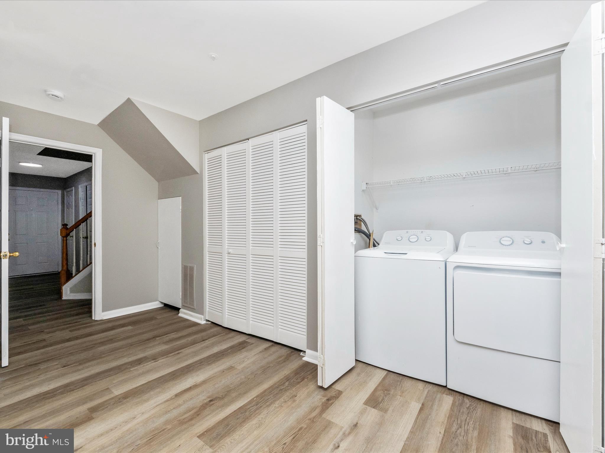 2242 Commissary Circle Odenton, MD 21113 - Photo 6 of 51 a view of storage and utility room with wooden floor