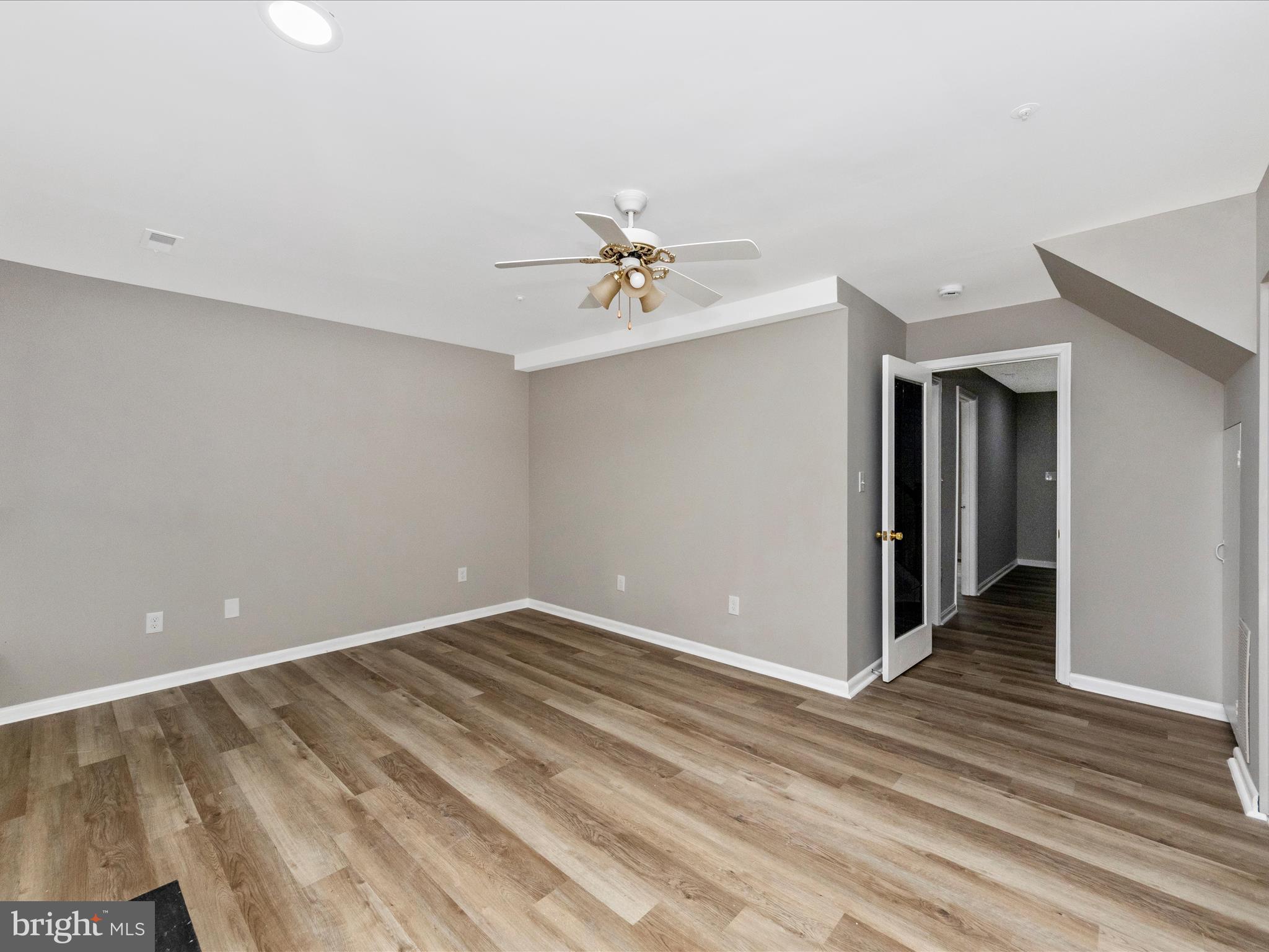 2242 Commissary Circle Odenton, MD 21113 - Photo 7 of 51 wooden floor in an empty room with a window