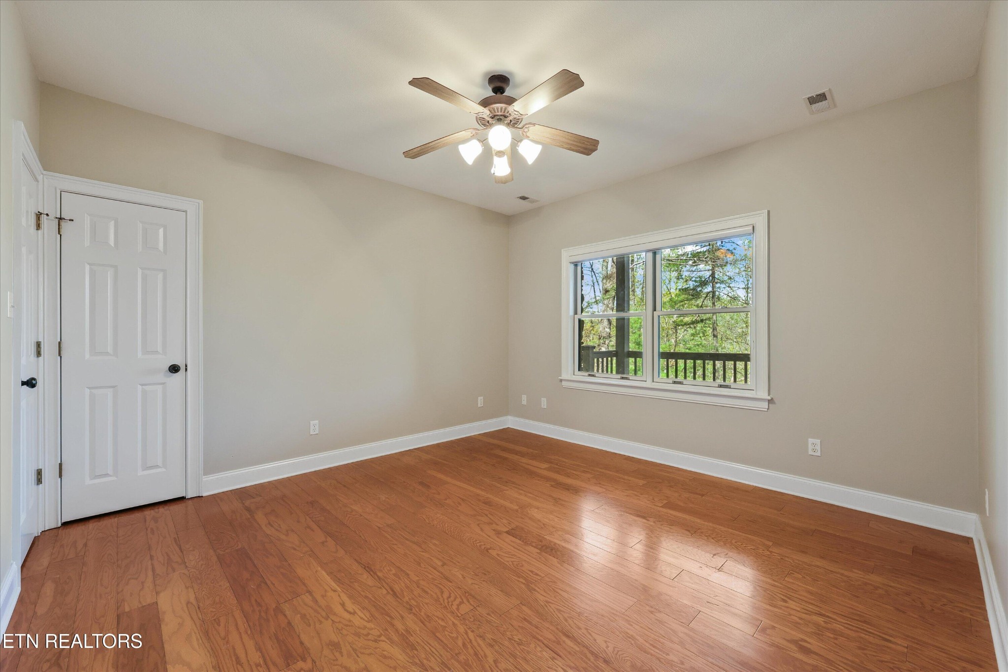 865 Stonegate Way Townsend, TN 37882 - Photo 36 of 60 wooden floor in an empty room with a window