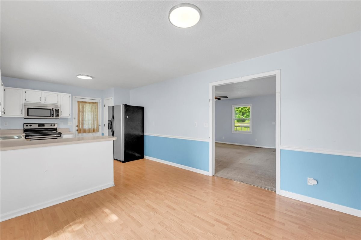 179 Eaton Heights Manchester, TN 37355 - Photo 14 of 33 a view of a kitchen with an empty space and a window