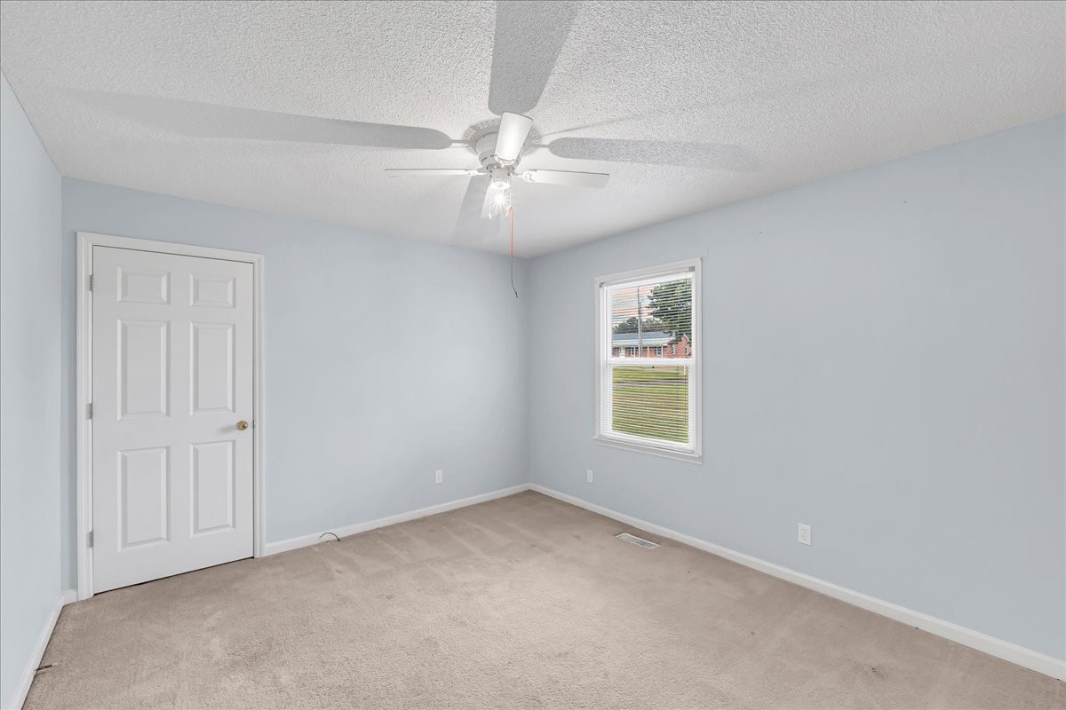 179 Eaton Heights Manchester, TN 37355 - Photo 17 of 33 an empty room with windows and fan