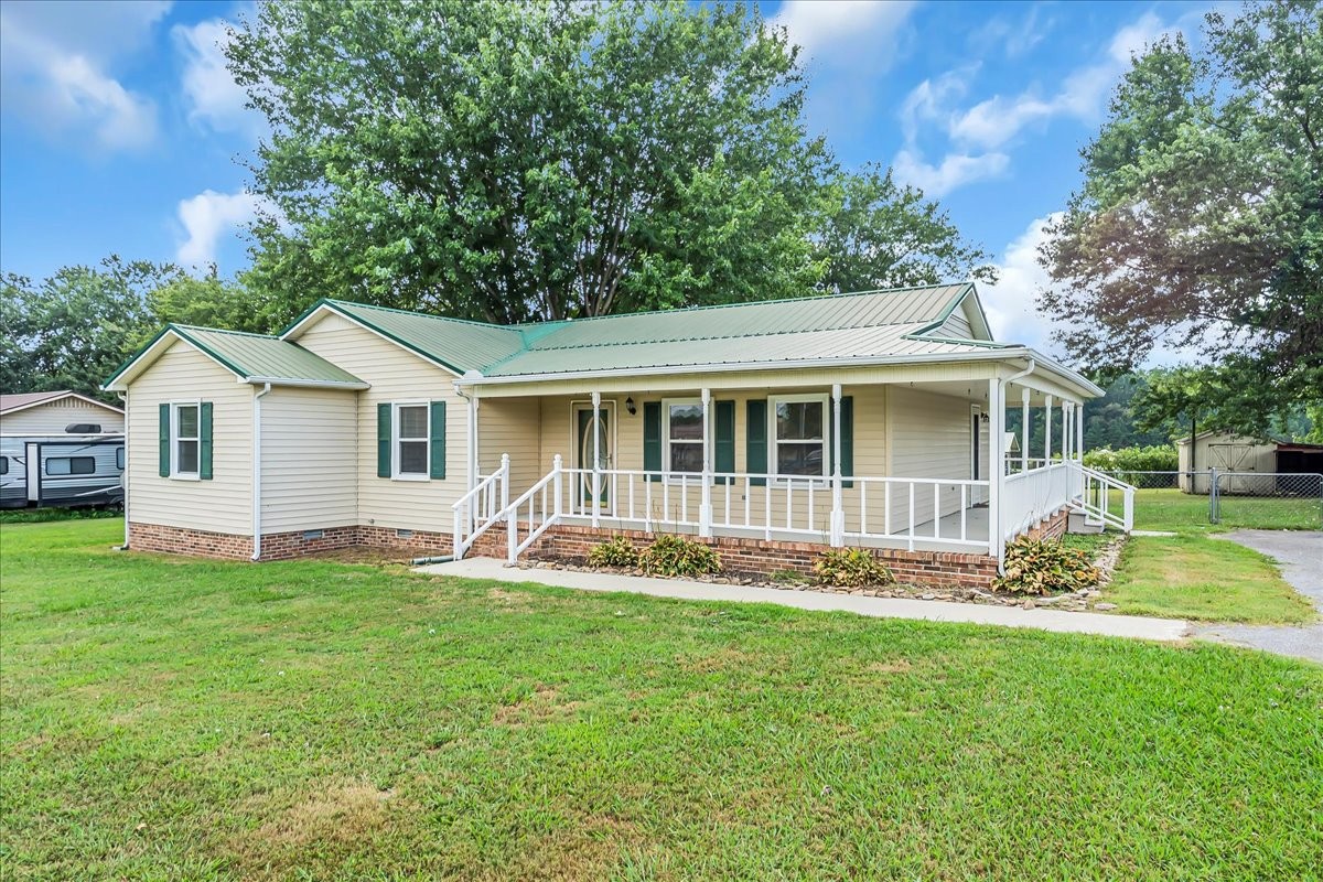 179 Eaton Heights Manchester, TN 37355 - Photo 3 of 33 a view of a house with a yard and trees