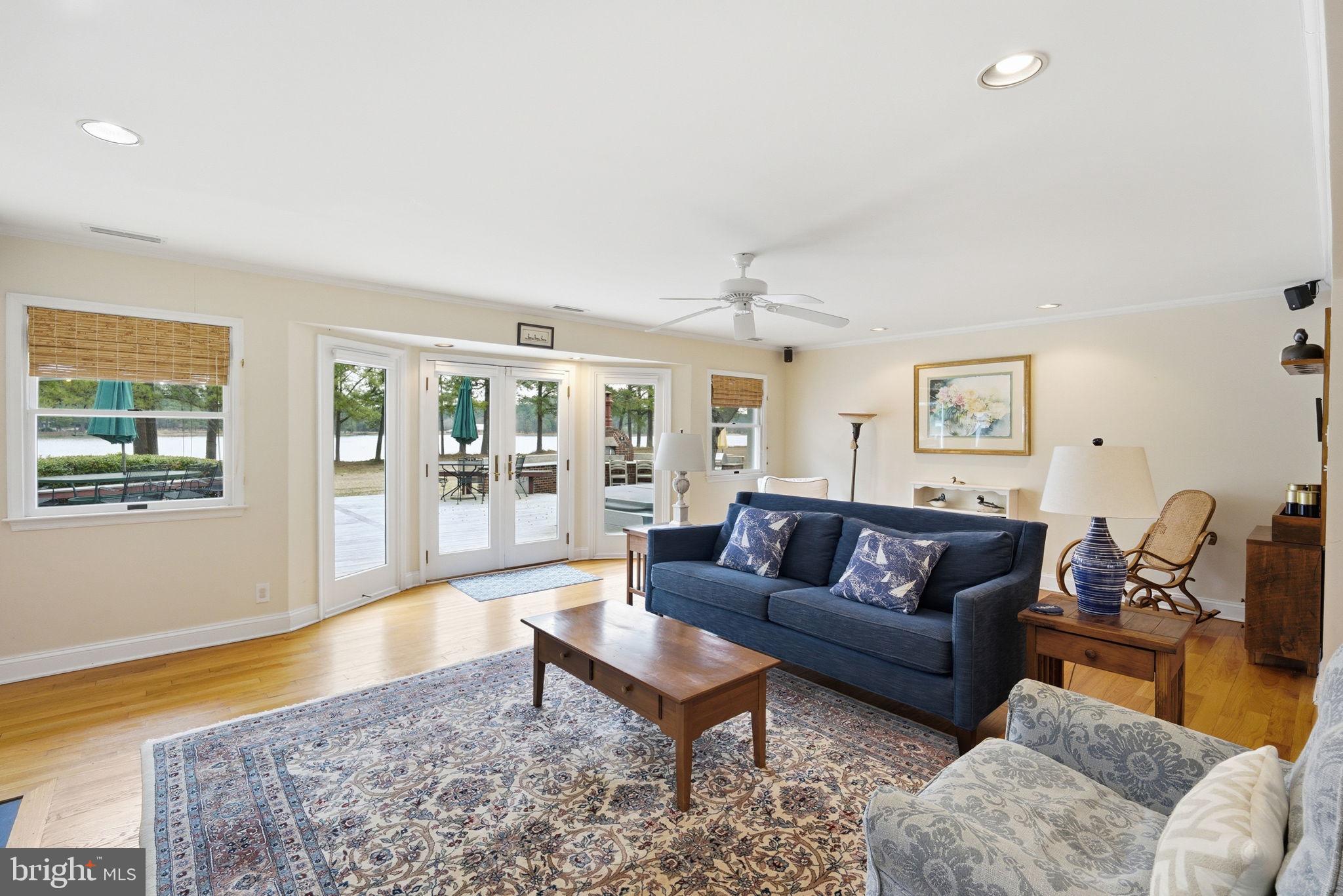 7149 Drum Point Road St. Michaels, MD 21663 - Photo 18 of 72 LIVING ROOM OVERLOOKING DECK