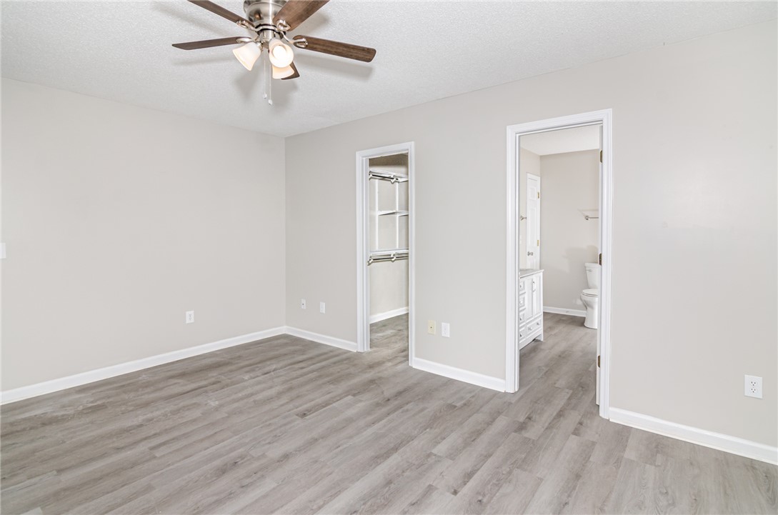 102 Hawk Ridge Drive Anderson, SC 29621 - Photo 11 of 38 This bright bedroom features durable flooring and convenient access to a private closet and bath.