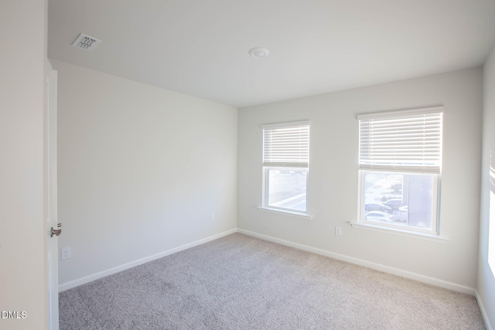 765 Larkspur Bowl Way Apex, NC 27523 - Photo 16 of 25 an empty room with windows