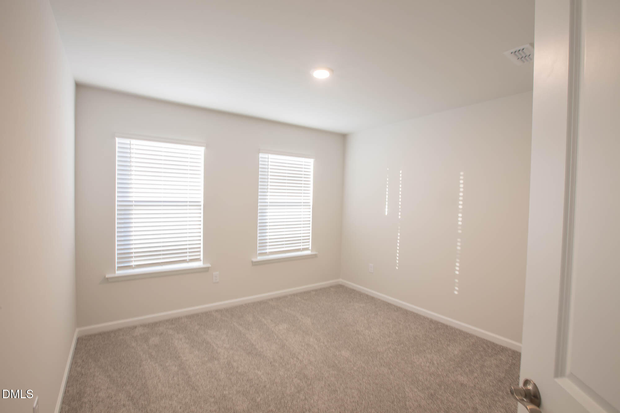 765 Larkspur Bowl Way Apex, NC 27523 - Photo 17 of 25 an empty room with windows