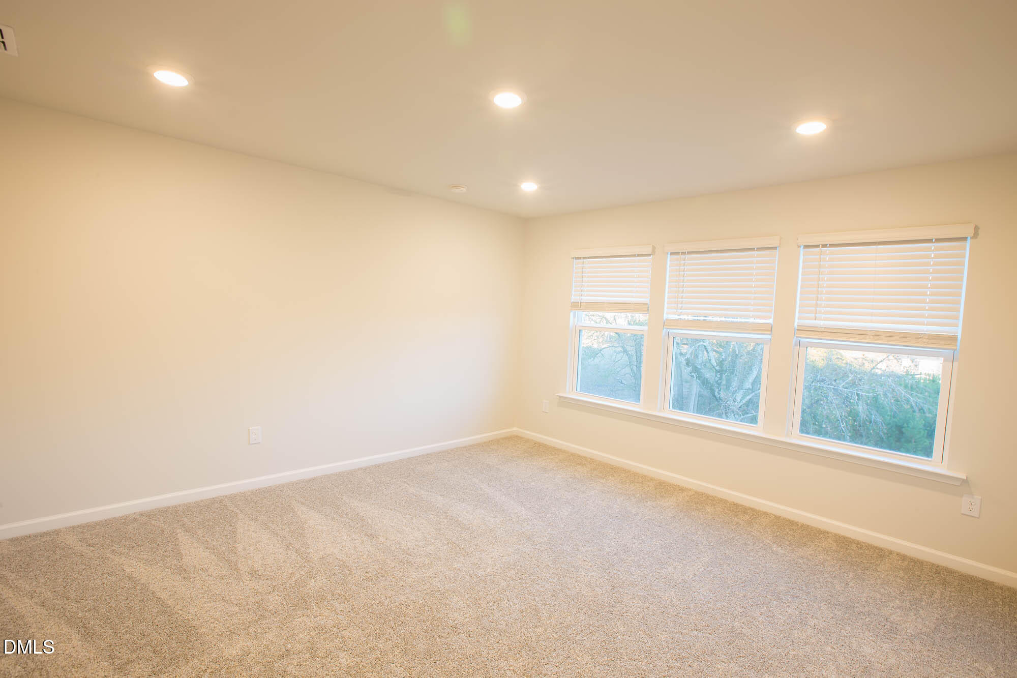 765 Larkspur Bowl Way Apex, NC 27523 - Photo 20 of 25 an empty room with windows
