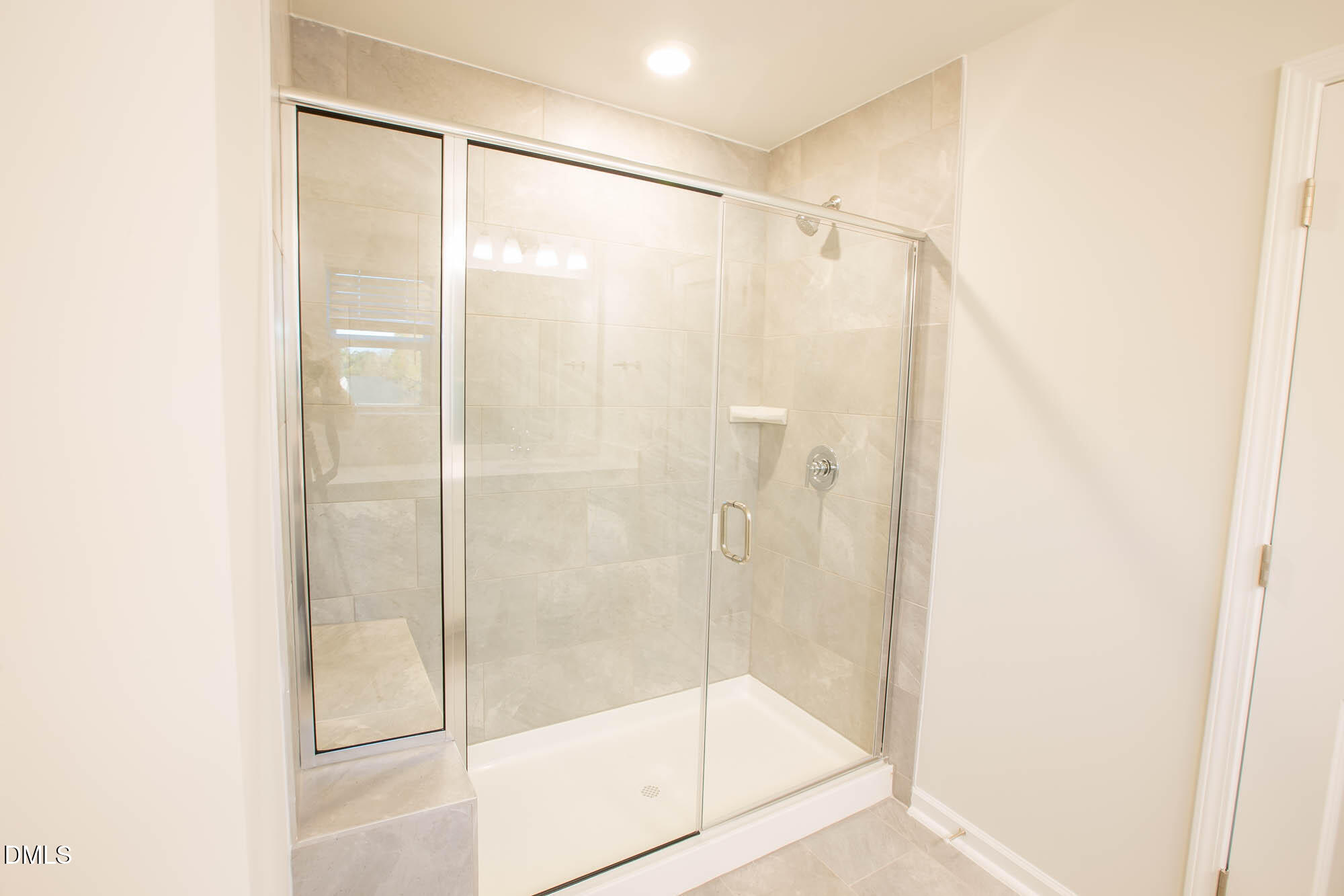 765 Larkspur Bowl Way Apex, NC 27523 - Photo 23 of 25 a bathroom with a glass shower door